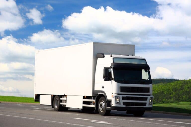 A white moving truck on its way to the new house