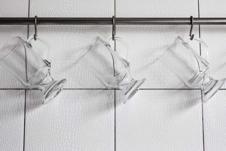 Glass mugs on hooks