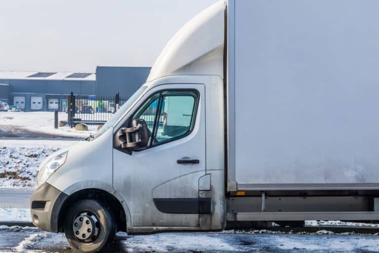 A parked van near a warehouse