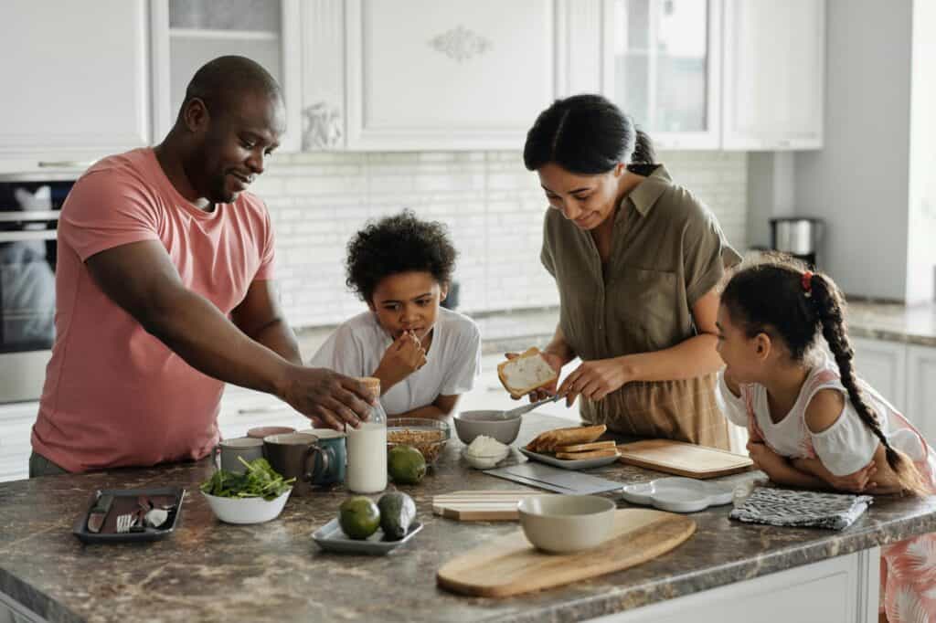 A young family having breakfast in the kitchen in the concept of moving to North London