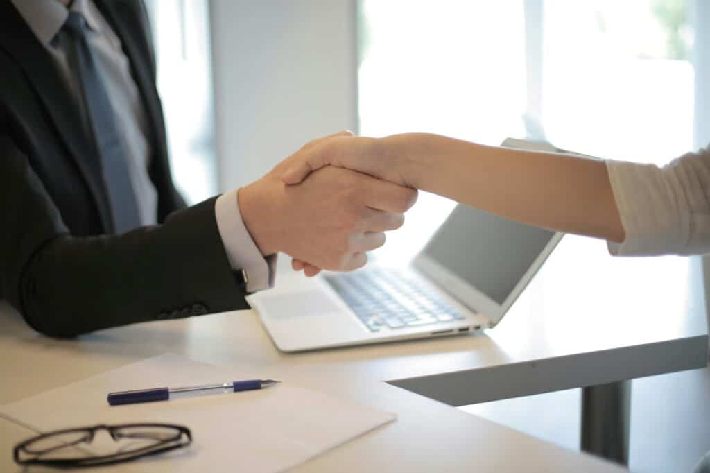 A cropped photo of shaking hands after a job interview