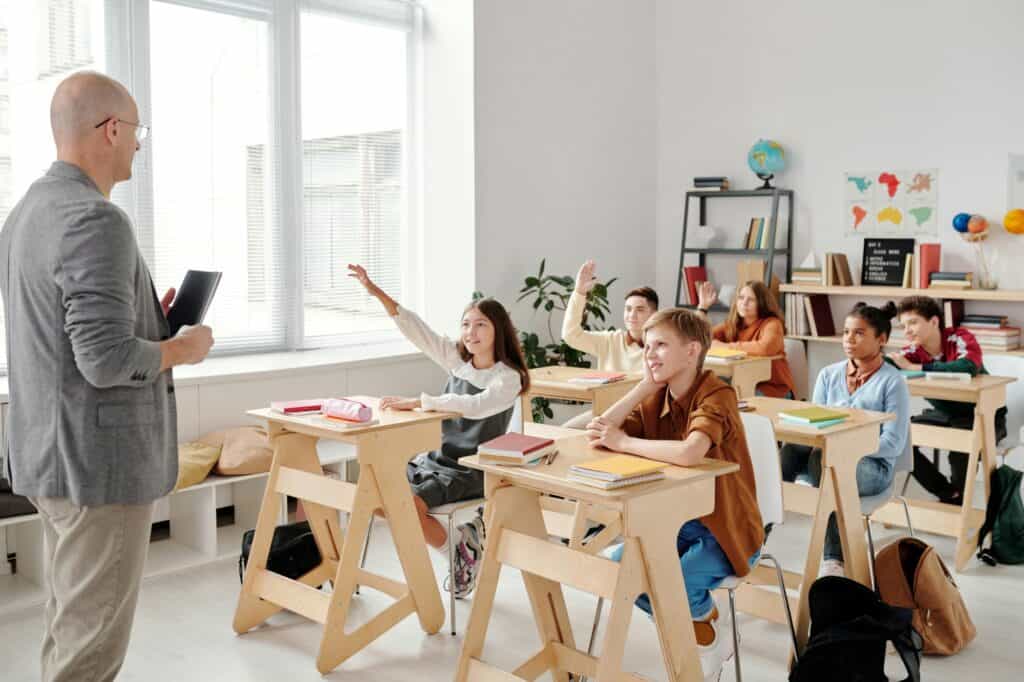 A small classroom with participative students in the concept of top schools North London.