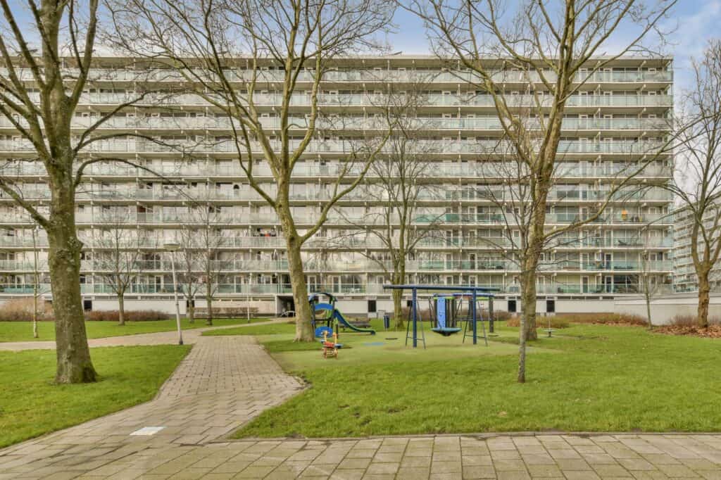 A block of flats with a children's playground