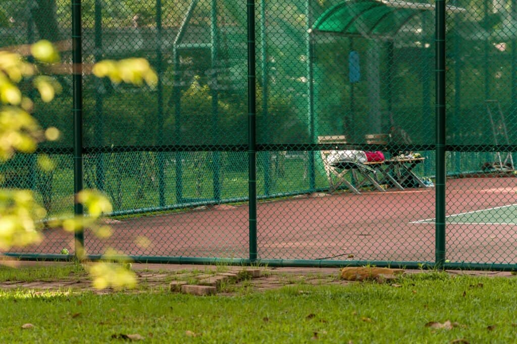 A public tennis court in a park